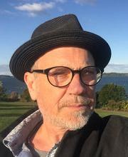 James Edwards headshot photo with lawn and ocean in background