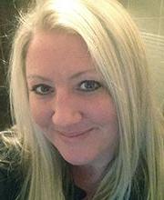 headshot photo of Dr. Nikki Freeburg smiling with long straight blond hair