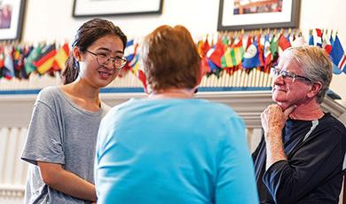 In conversation with international student Yi Wei Huang (right) are Steve Black and Barbara Black.