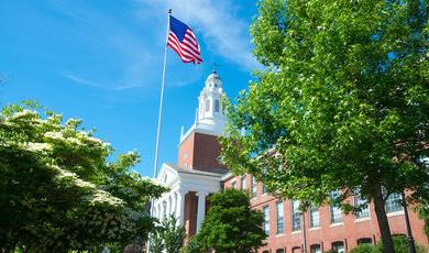 photo of Boyden Hall surrounded by green and flowering trees