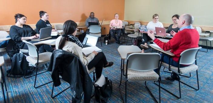 Political Science class with desks arranged in a circle